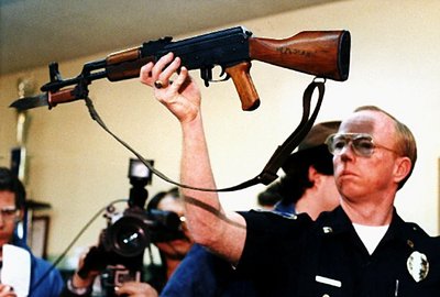 "1989 file photograph: Stockton Police Capt. J.T. Marnoch holds up a Chinese-made AK-47 assault rifle that gunman Patrick Purdy used to kill five schoolchildren and injure 30 others at Cleveland Elementary School in Stockton. (AP Photo/Rich Pedroncelli, File)"