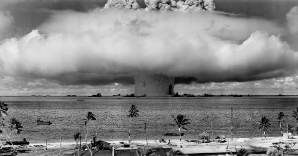 Shot "Baker" of Operation Crossroads — one of the more famous mushroom clouds of all time. Note that the mushroom cloud itself is not the wide cloud you see there (which is a brief condensation cloud caused by it being an underwater detonation), but is the more bulbous cloud you see peaking out of the top of that cloud. You can see the battleships used for target practice near base of the cloud. The dark mark on the right side of the stem may be an upturned USS Arkansas. 