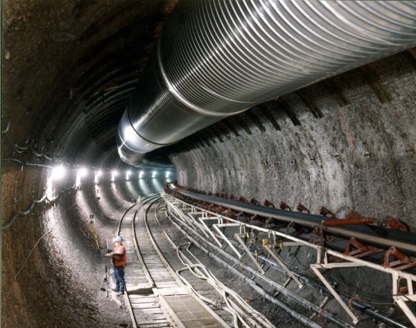 d: Exploratory tunnel dug by a 25-foot-diameter tunnel boring machine at the proposed  Yucca Mountain, Nevada, repository for spent nuclear fuel. From the DOE Digital Archive.
