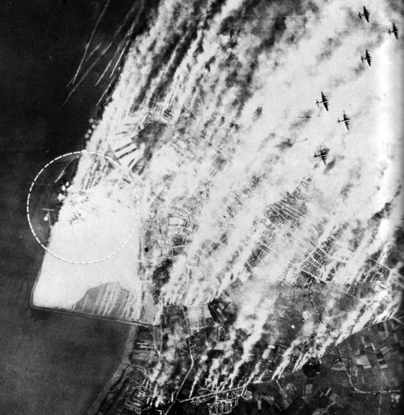 German smokescreen use at Wilhelmshaven in June 1943. Caption: "Despite a smoke screen, 168 B-17s of the Eighth Air Force attacked Wilhelmshaven on 11 June. There are three lines of generators to windward of the area covered when the wind is in the north, as it was in this case. Generator boats are at the upper left. Despite the extent of the smoke screen hits are observed inside the circle..." Source: USAAAF IMPACT magazine, vol. 1, No. 5, August 1945, page 18.