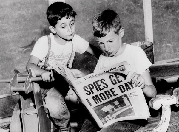 "Ethel and Julius Rosenberg’s sons, Robert, 6, left, and Michael, 10, looking at a 1953 newspaper. They still believe their parents did not deserve to die." Photo from the Associated Press, via the New York TImes