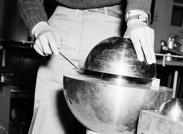 Close-in shot on the Slotin accident re-creation. The beryllium tamper is on top; the plutonium core is the smaller sphere in the center. Notice in this particular shot, they have a "shim" on the right. Slotin removed the shim right before his fatal slip.
